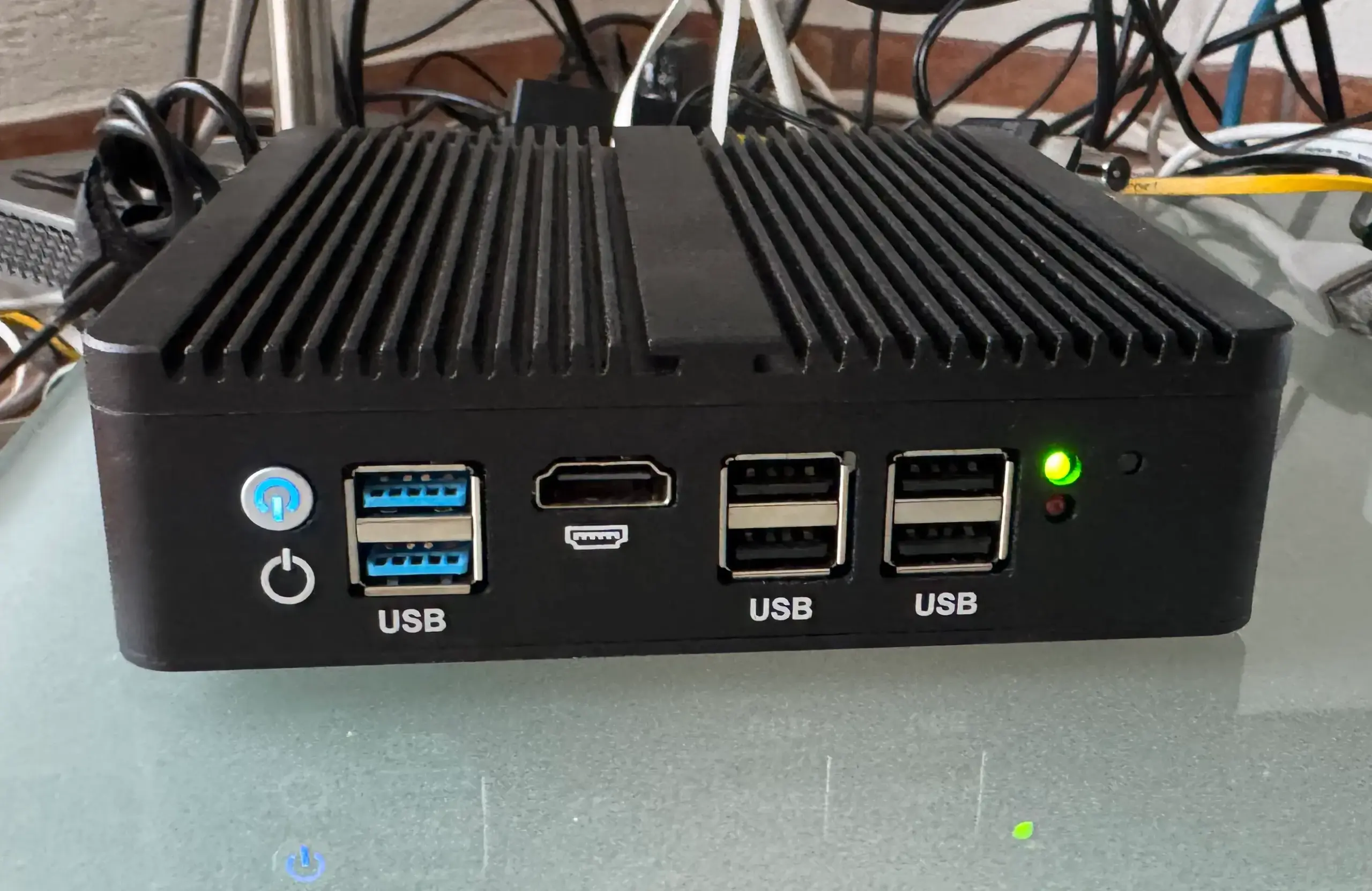 Fanless XCY mini-PC running Proxmox Backup Server 24/7 in a homelab setup
