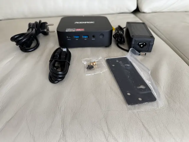 Acemagic K1 Mini PC Review – Is This Low-Power Ryzen Box Worth It? 4 Contents of the Acemagic K1 package including mini PC, power adapter, HDMI cable, VESA mount, and screws